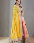 Mango And Peach Bandhej Lehenga Set With A Yellow Dupatta