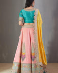 Mango And Peach Bandhej Lehenga Set With A Yellow Dupatta