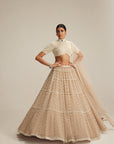 Light Beige Pearl Drop Multi Tier Lehenga With High Neck Blouse Set.